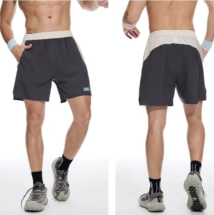Men's loose grey workout shorts with elastic and lace-up waistband for gym training.