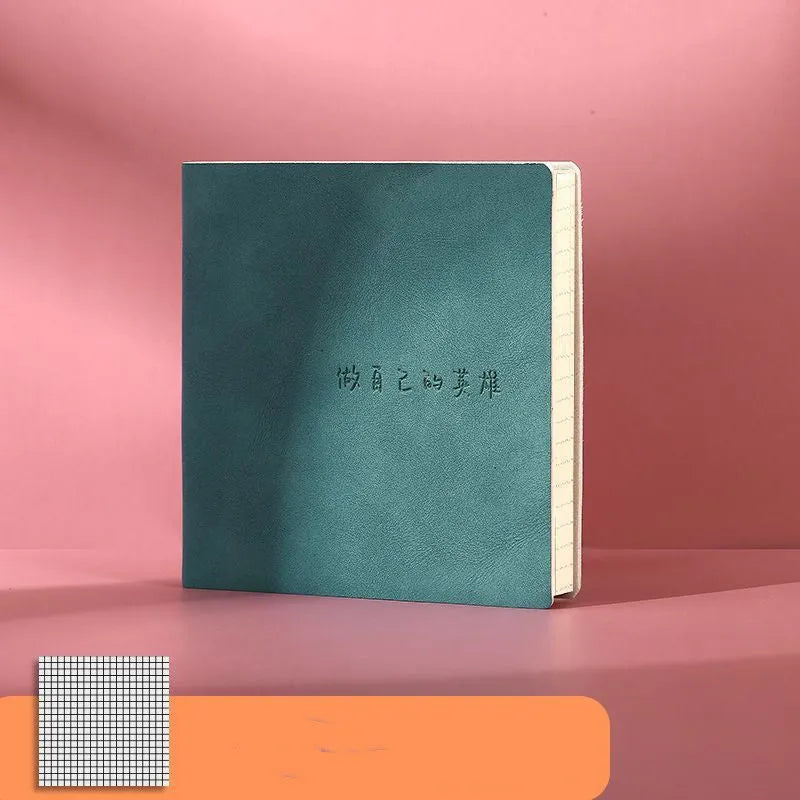 Square faux leather notebook in avocado green with open pages showing blank format.