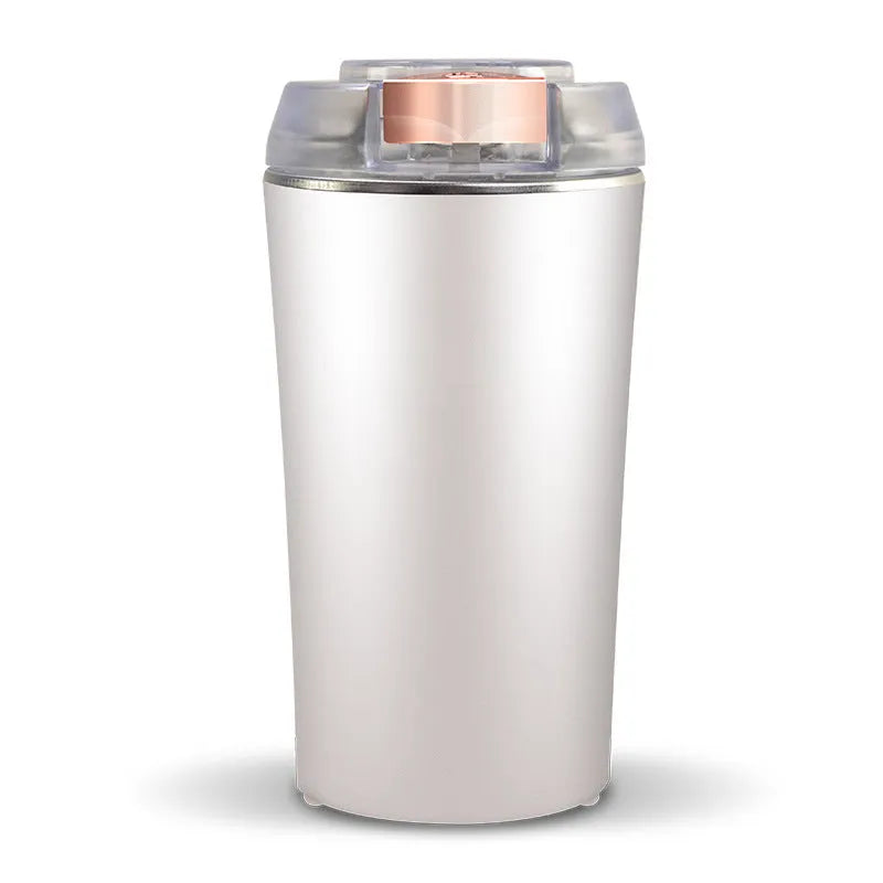 Blue mini flour mill and grinder machine for making seasoning powders on a kitchen counter.