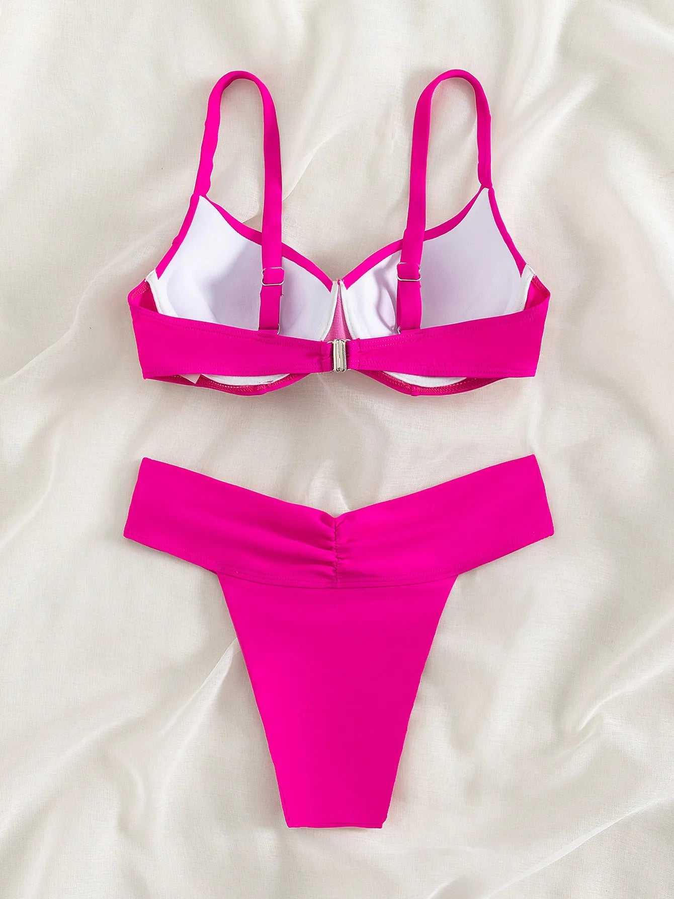 Women's solid colour sleeveless bikini swimsuit set with bra and briefs on a mannequin