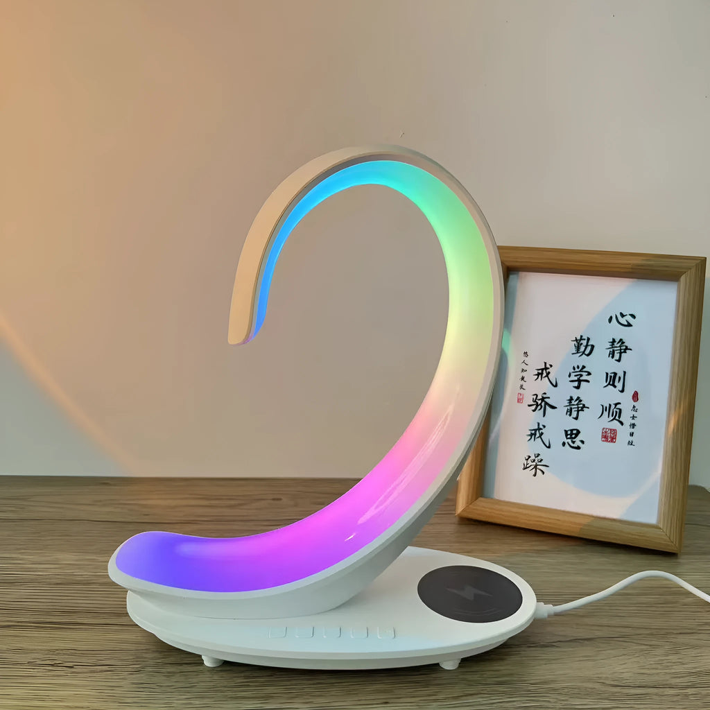 White swan shaped desktop wireless charger with Bluetooth speaker and colourful ambient lighting