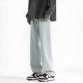 Men's light blue washed straight leg jeans with button waist, made from cotton denim fabric.