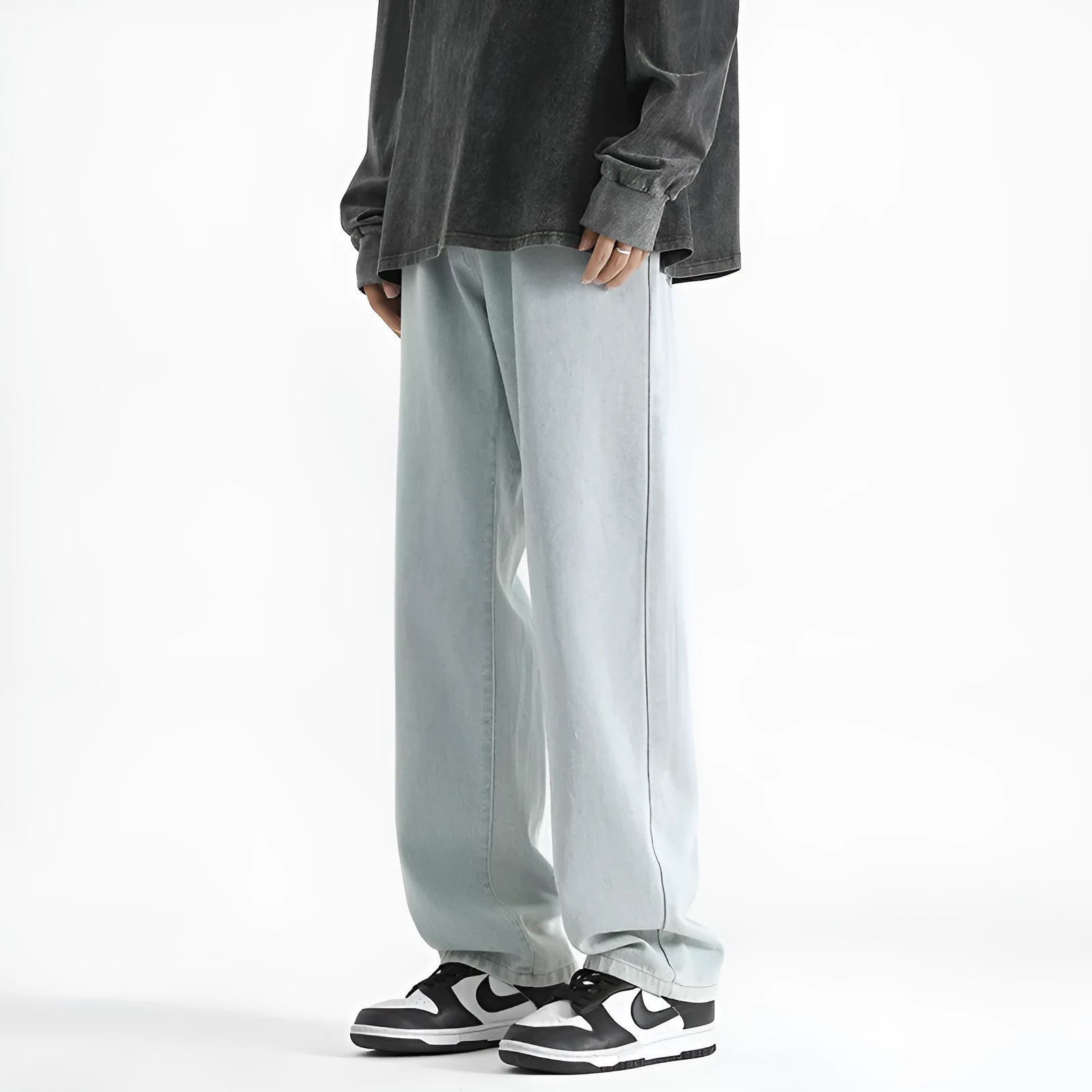 Men's light blue washed straight leg jeans with button waist, made from cotton denim fabric.
