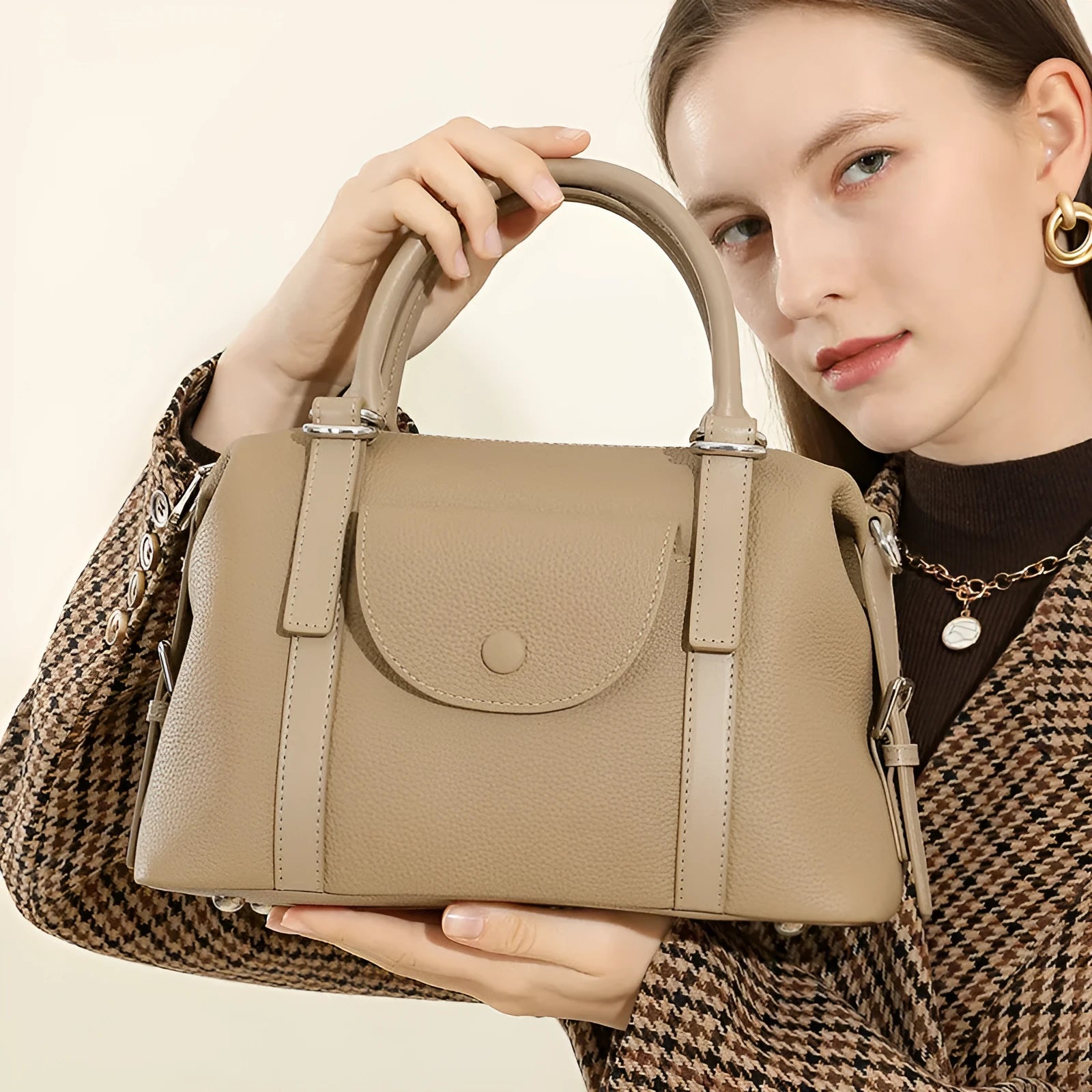 Genuine leather ladies handbag in street trend style with stitching and lock detail