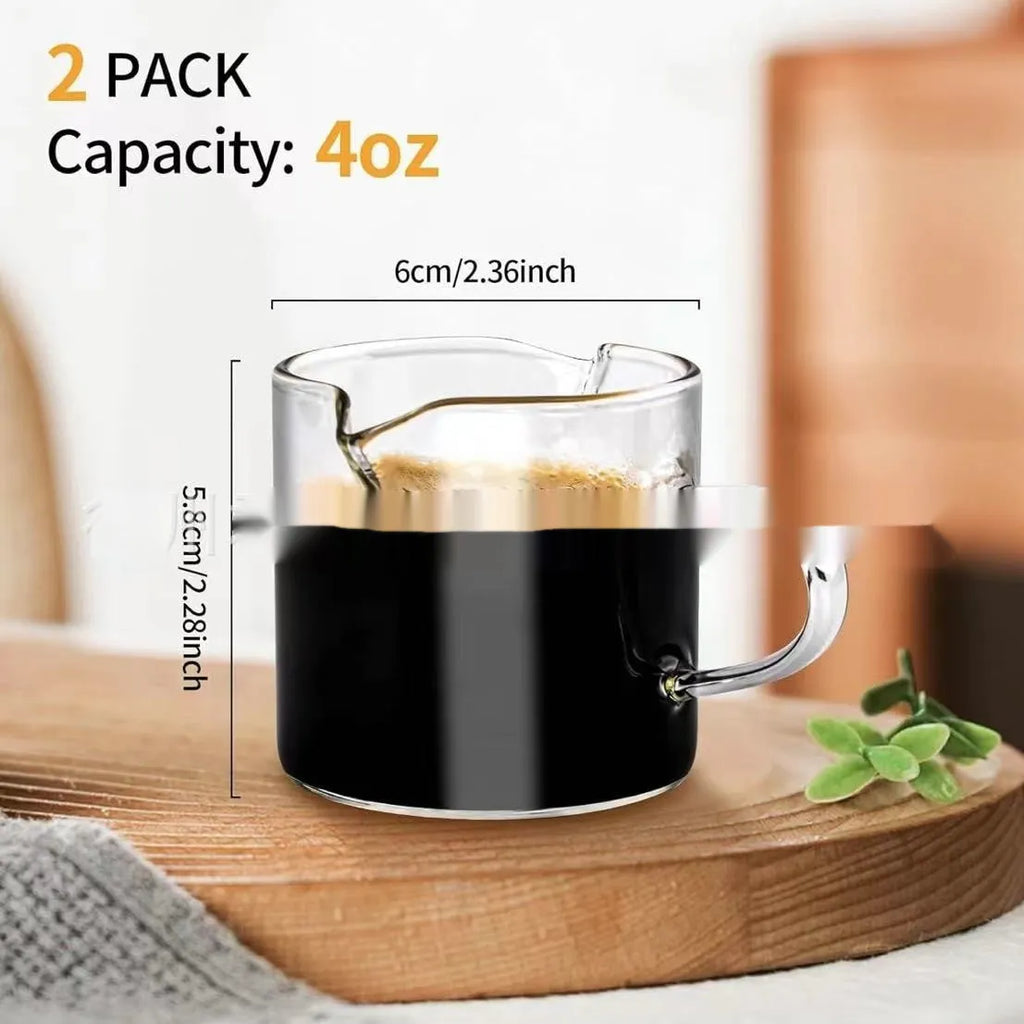 White transparent glass double mouth coffee cup on a flat surface, showing its simple modern design