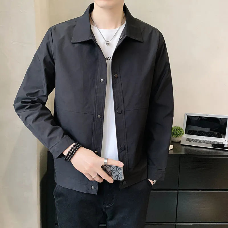 Men's Korean style thin single layer jacket in grey tones, with long sleeves, shown on a hanger.