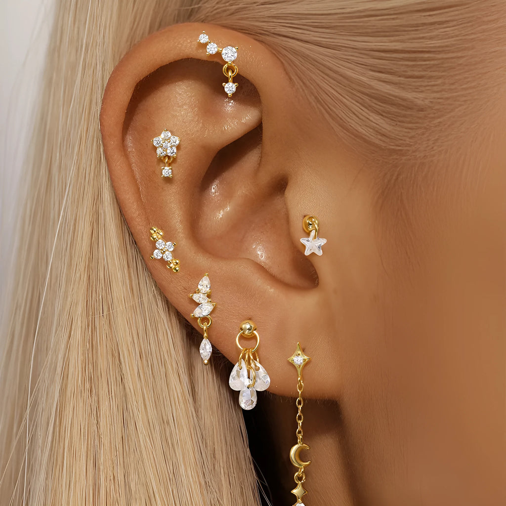 S925 sterling silver geometric stud earrings with moon shape and diamond-embedded star detail in a gold tone.