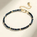 Close-up of a women's blue tourmaline bracelet with 3mm cut beads and spacer bead design.
