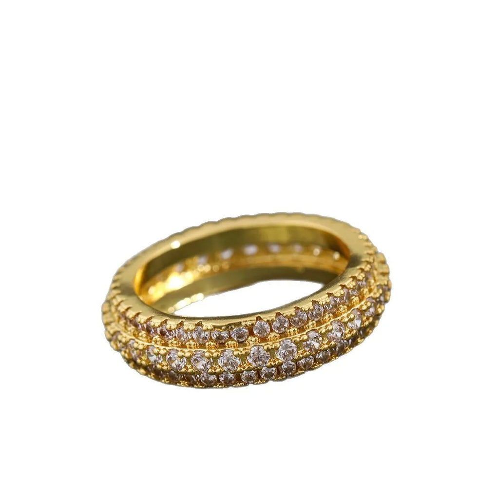 Geometric personalised engagement ring with triangular zircon stone on a copper band.
