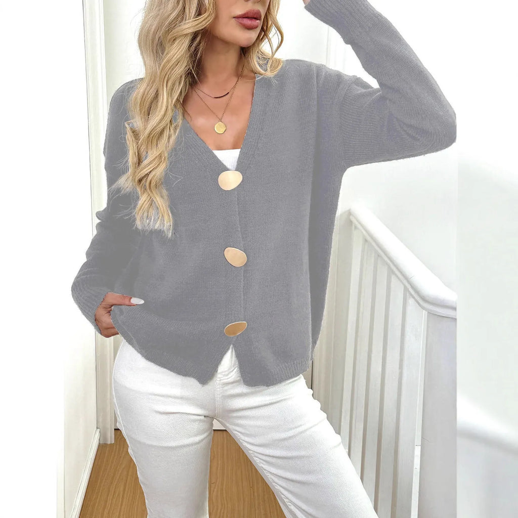 A grey women's deer plush long sleeve sweater coat with Princess sleeves on a hanger.