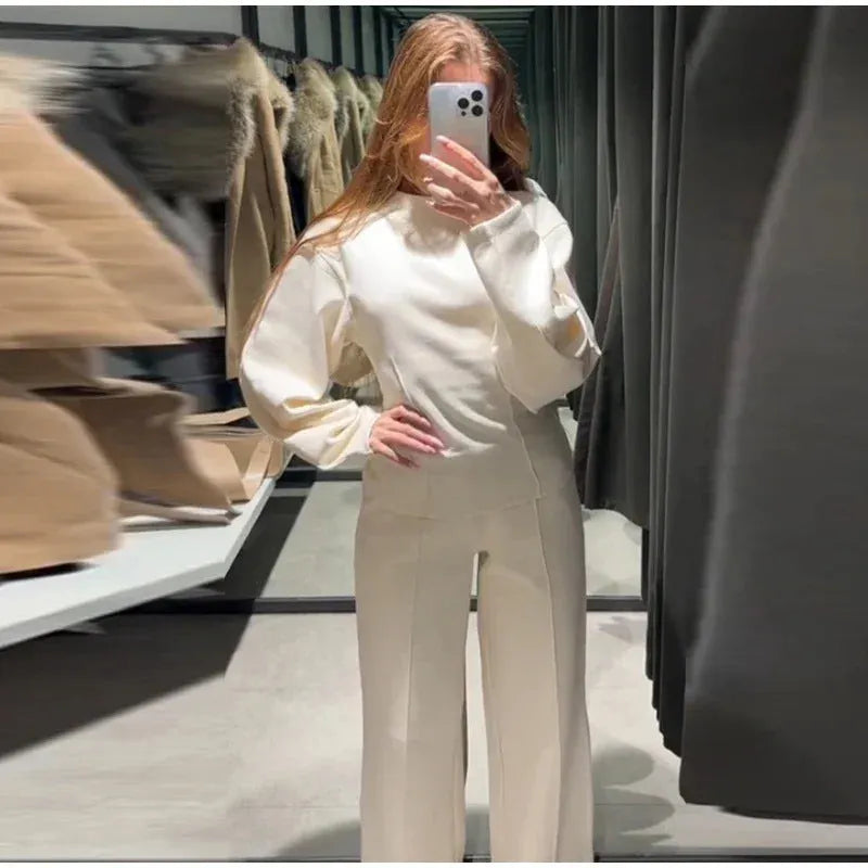 Women's black polyester fleece two-piece suit with long sleeve top and wide-leg trousers