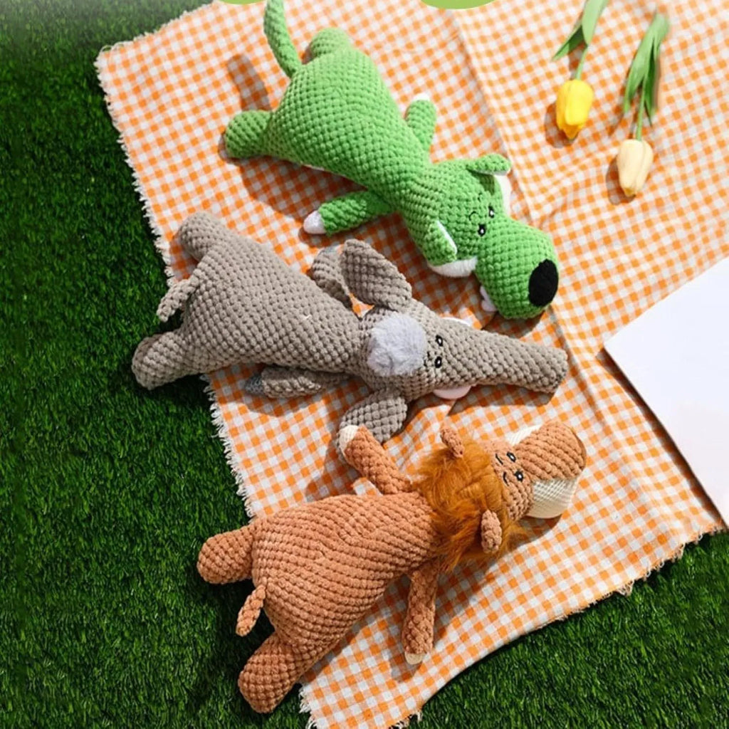 Corn kernel shaped plush dog chew toy with animal designs and squeaker sound feature