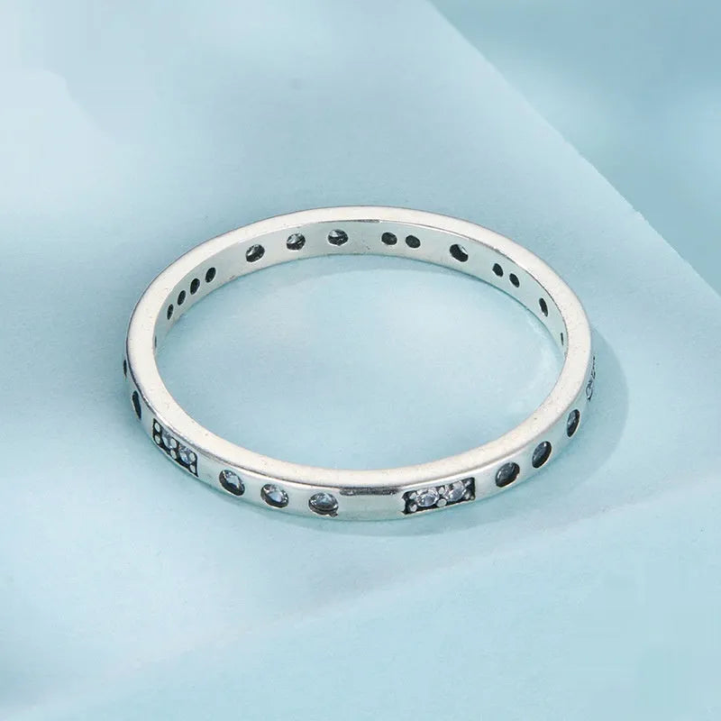 Black oxidised alloy ring with engraved 'I Love You' text, shown on a finger.