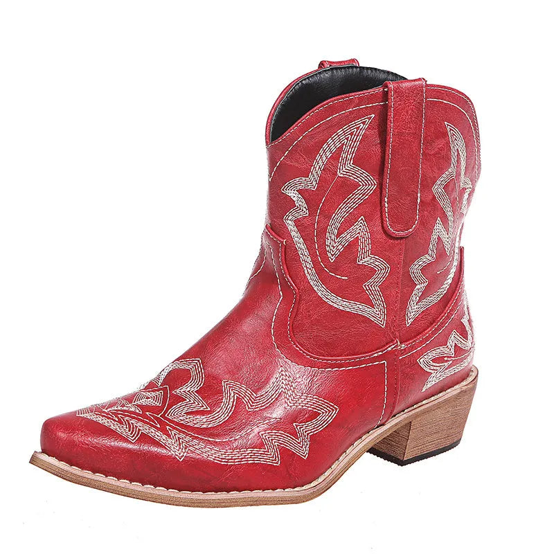 Women's blue embroidered cowboy ankle boots with a low wedge heel and pointed toe.
