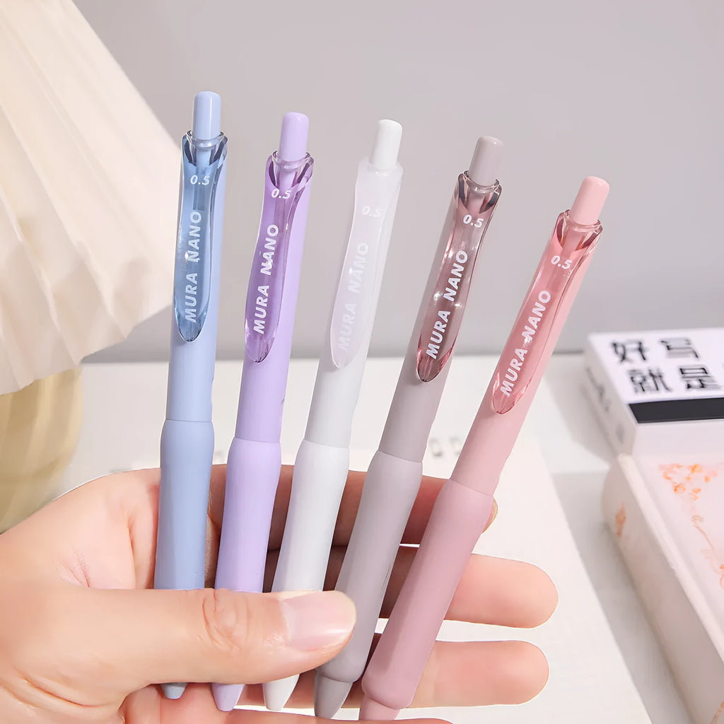 Macaron colour press gel pen with 0.5mm tip shown in Smoked Brown, Smoked Powder, and Smoked White refill options.