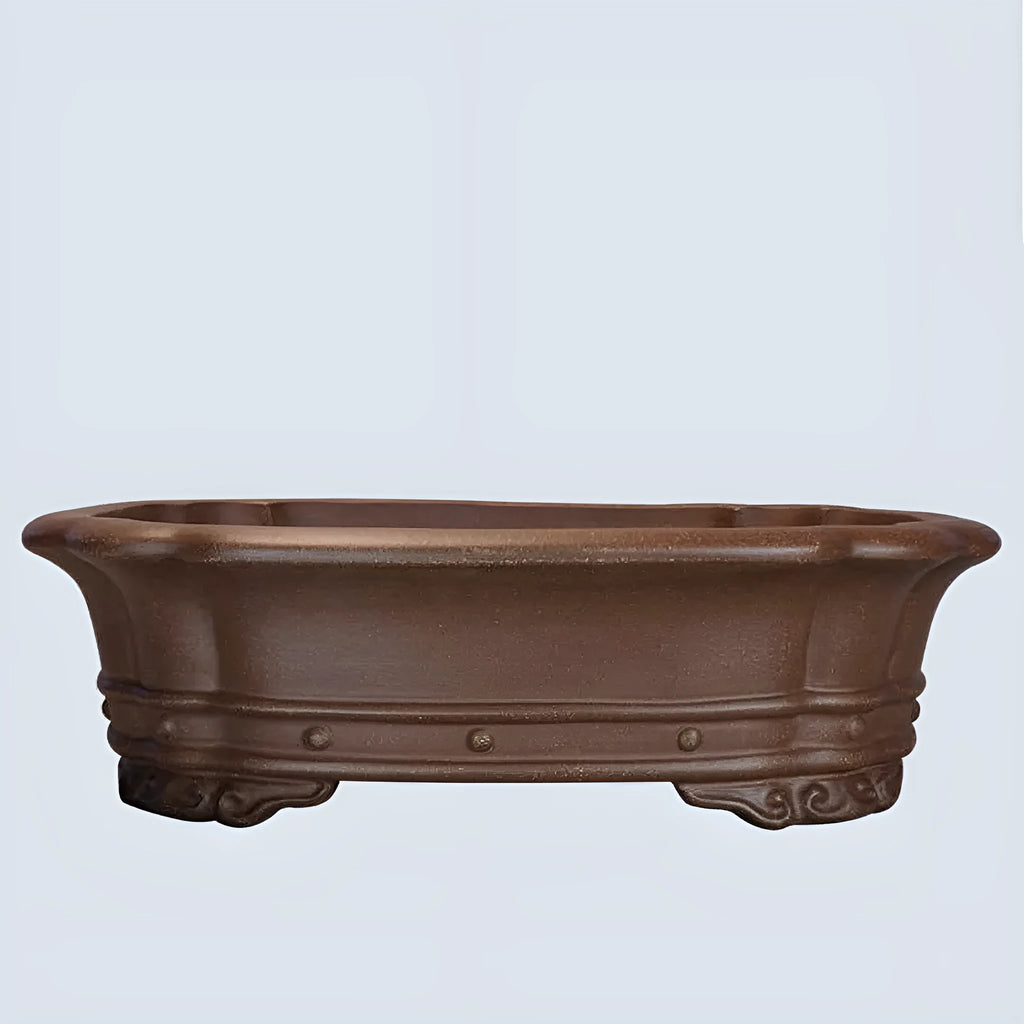 Purple sand handmade rectangular begonia flower pot on a tabletop.
