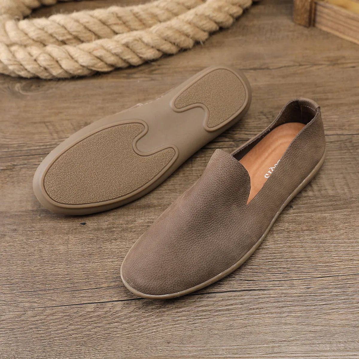 Handmade grey and khaki men's low-top casual sneakers with a cowhide upper and rubber wedge sole.