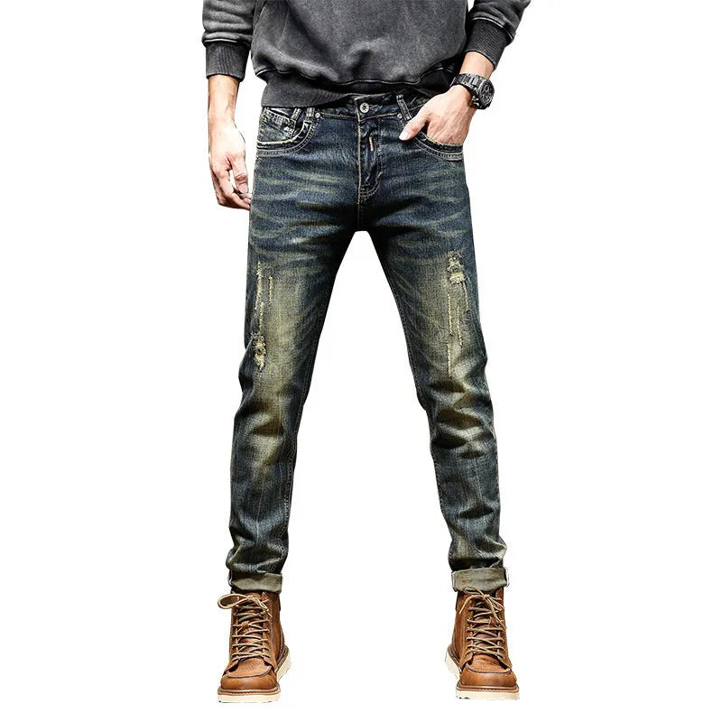 Men's skinny fit jeans in retro colour showing zip fly and tapered leg.