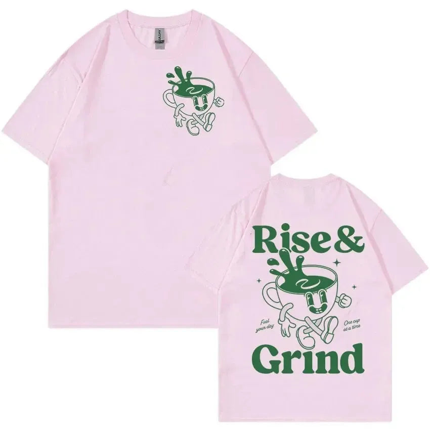 Front view of a loose-fit linen T-shirt featuring a printed 'Rise And Grind Green Coffee' cartoon design in black on a light-coloured fabric.