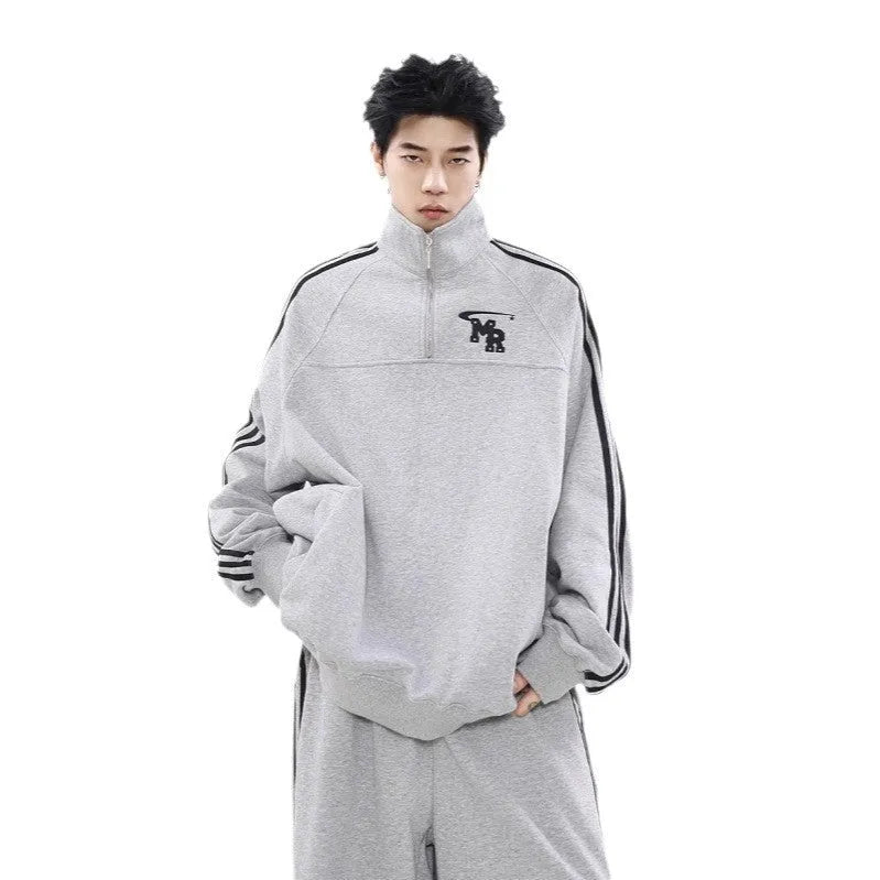 Black Hong Kong style polyester hoodie with stand collar on a hanger.