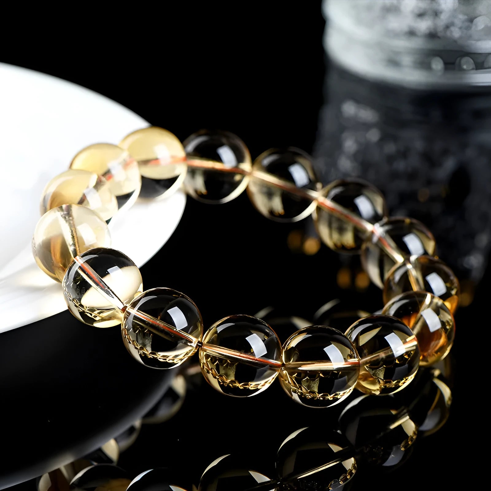 Natural citrine scattered beads ball bracelet in 7A and 6A colour grades on a white background.
