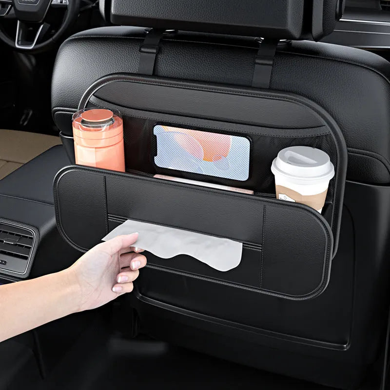 Black leather car seat rear storage bag showing its box shape and size against a vehicle seat.
