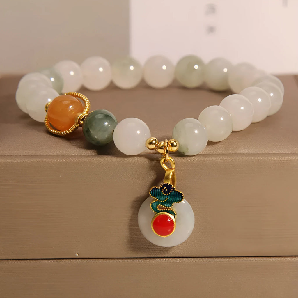 Women's Ice Jade jade bracelet with a Xiangyun peace buckle and pearl details on a white background.