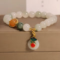 Women's Ice Jade jade bracelet with a Xiangyun peace buckle and pearl details on a white background.