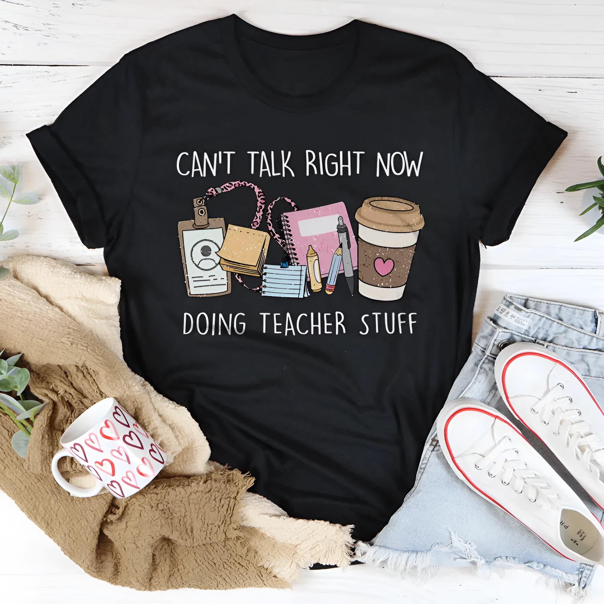Black cotton summer T-shirt with round neck and short sleeves showing loose straight cut styling