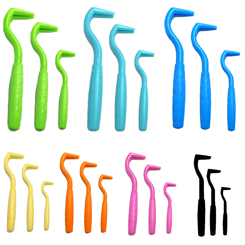Three plastic tick removal hooks in different colours for pet parasite control