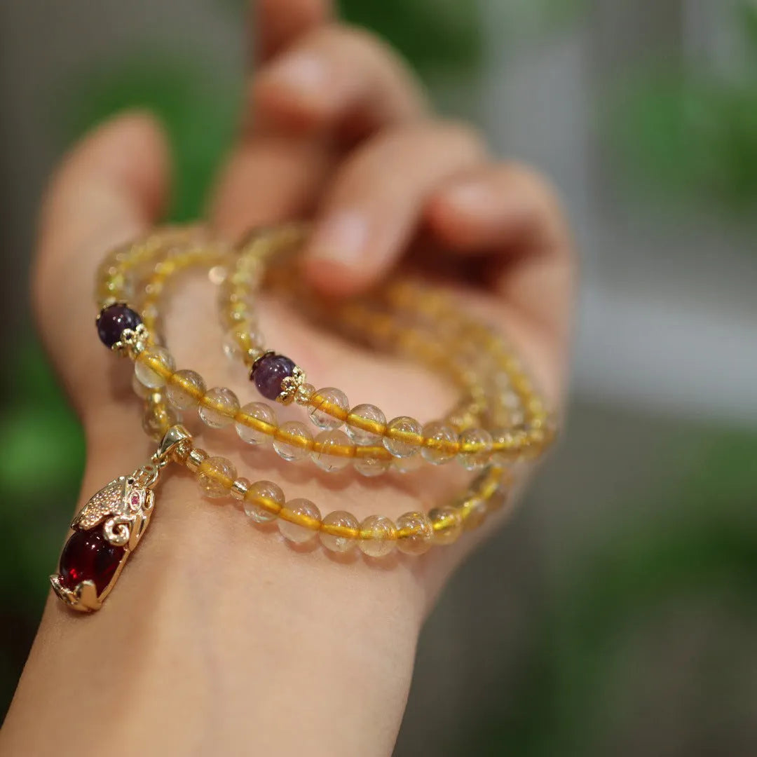 Natural Brazil gold rutilated quartz bracelet with three gold circles and ruby quartz hanging chopsticks charm
