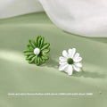 Cartoon-style flower alloy earrings in blue and orange, white and green, and yellow and white two-tone colour options