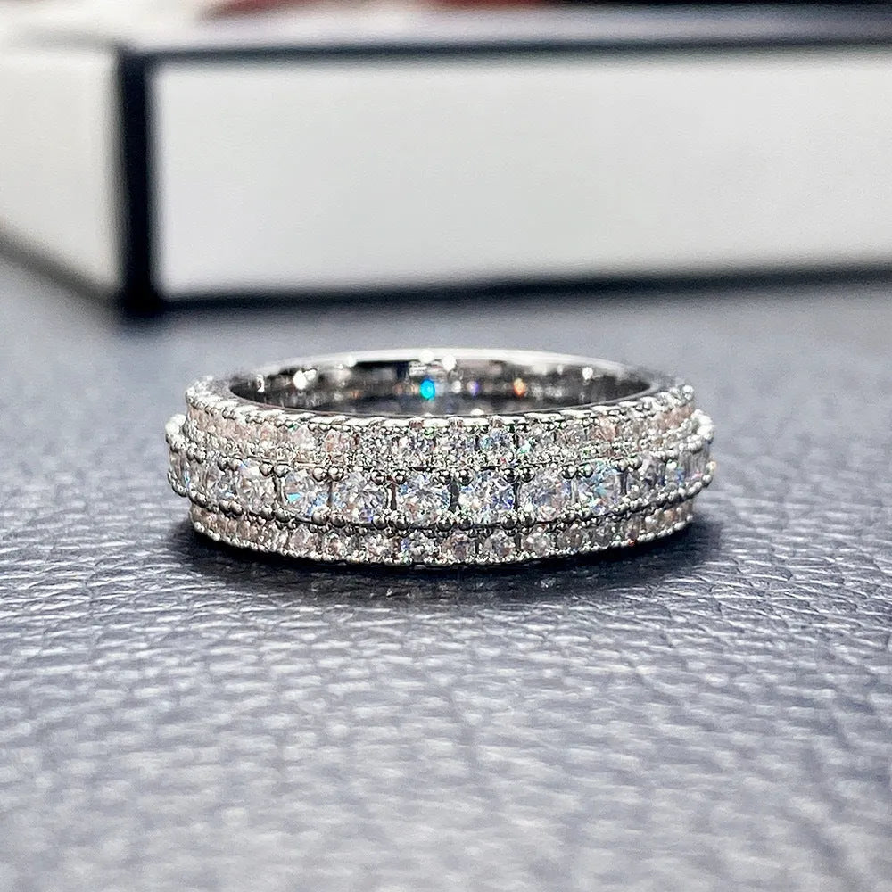 Geometric personalised engagement ring with triangular zircon stone on a copper band.