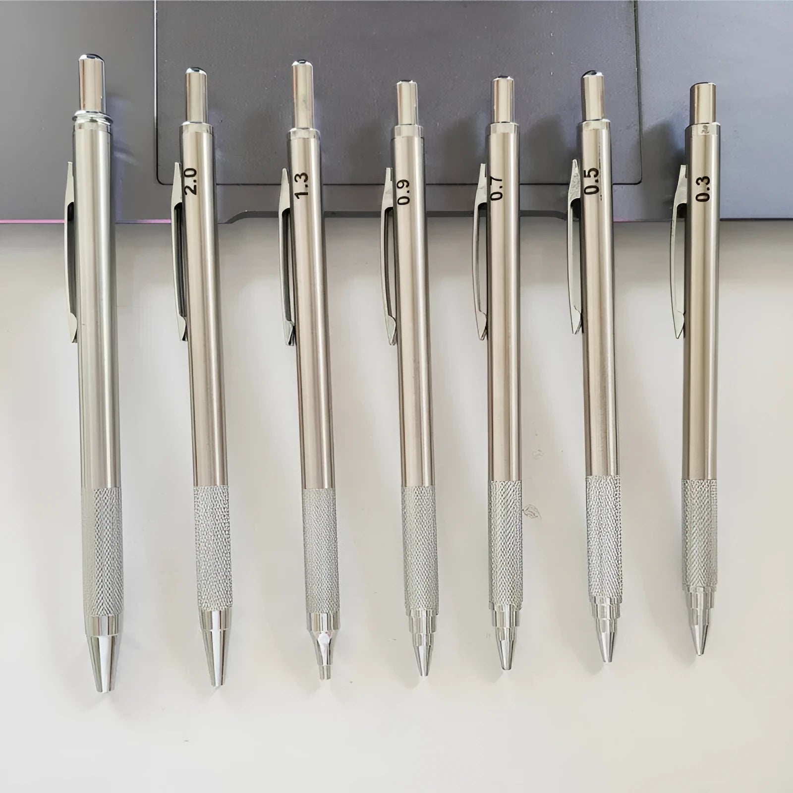 Metal automatic mechanical pencil with 2B graphite refill showing lead size options