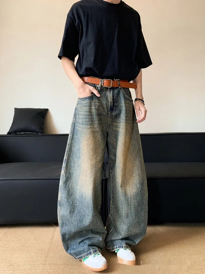 Men's retro blue distressed denim wide-leg pants with vintage styling and slimming silhouette