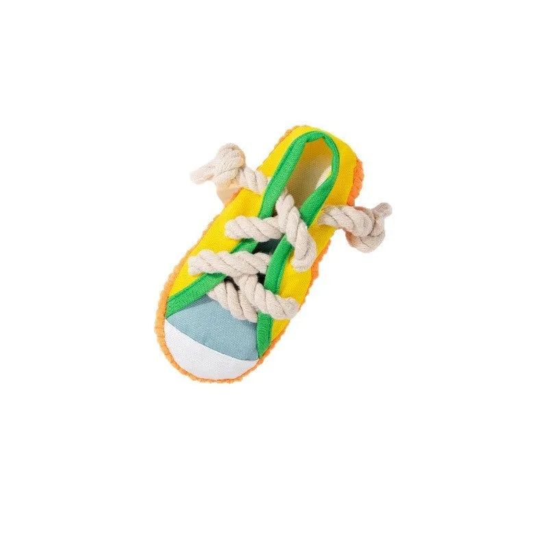 Plastic dog chew toy shaped like a slipper in yellow, black, and blue colour options.