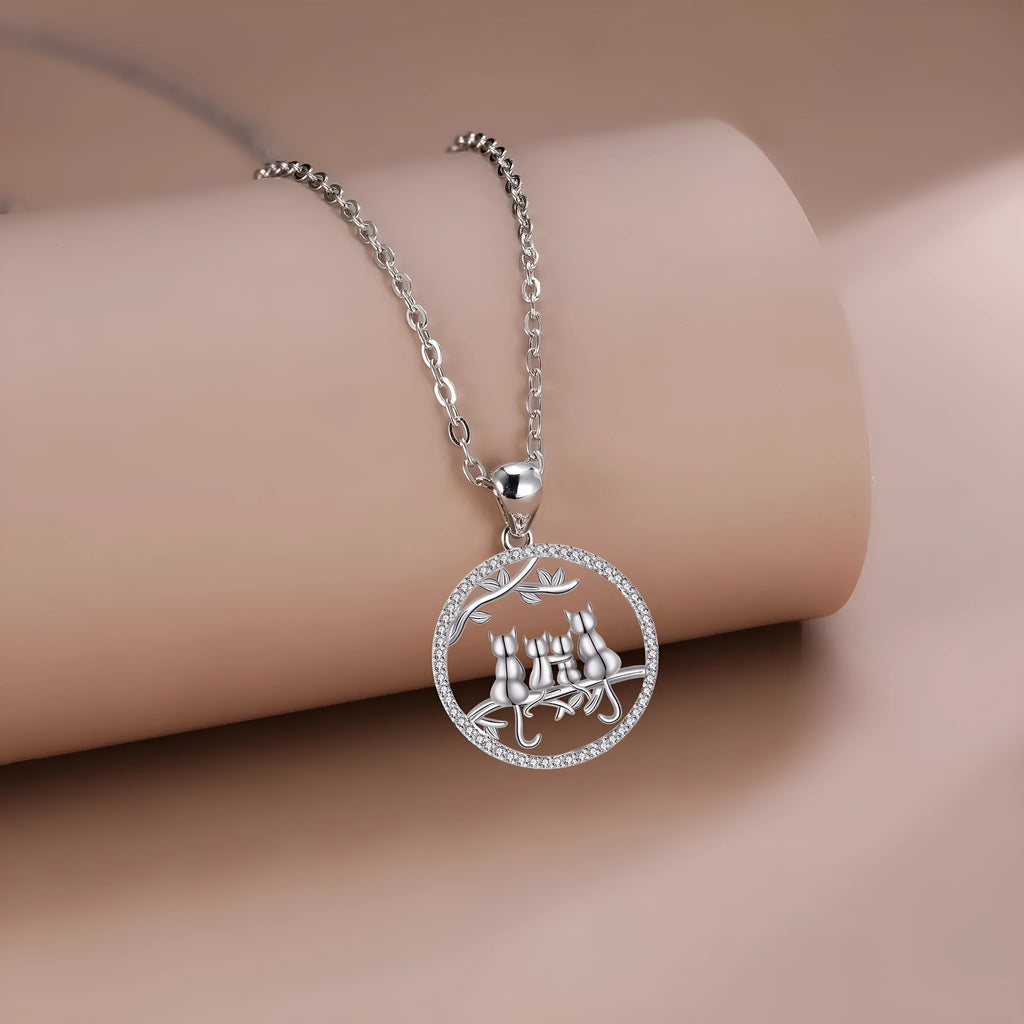 Copper Four Kitten Necklace with cross chain, electroplated finish, original cat design.