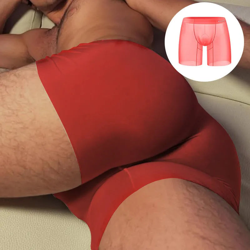 Men's seamless low-waist boxer shorts in orange nylon with a hip-lift contour.
