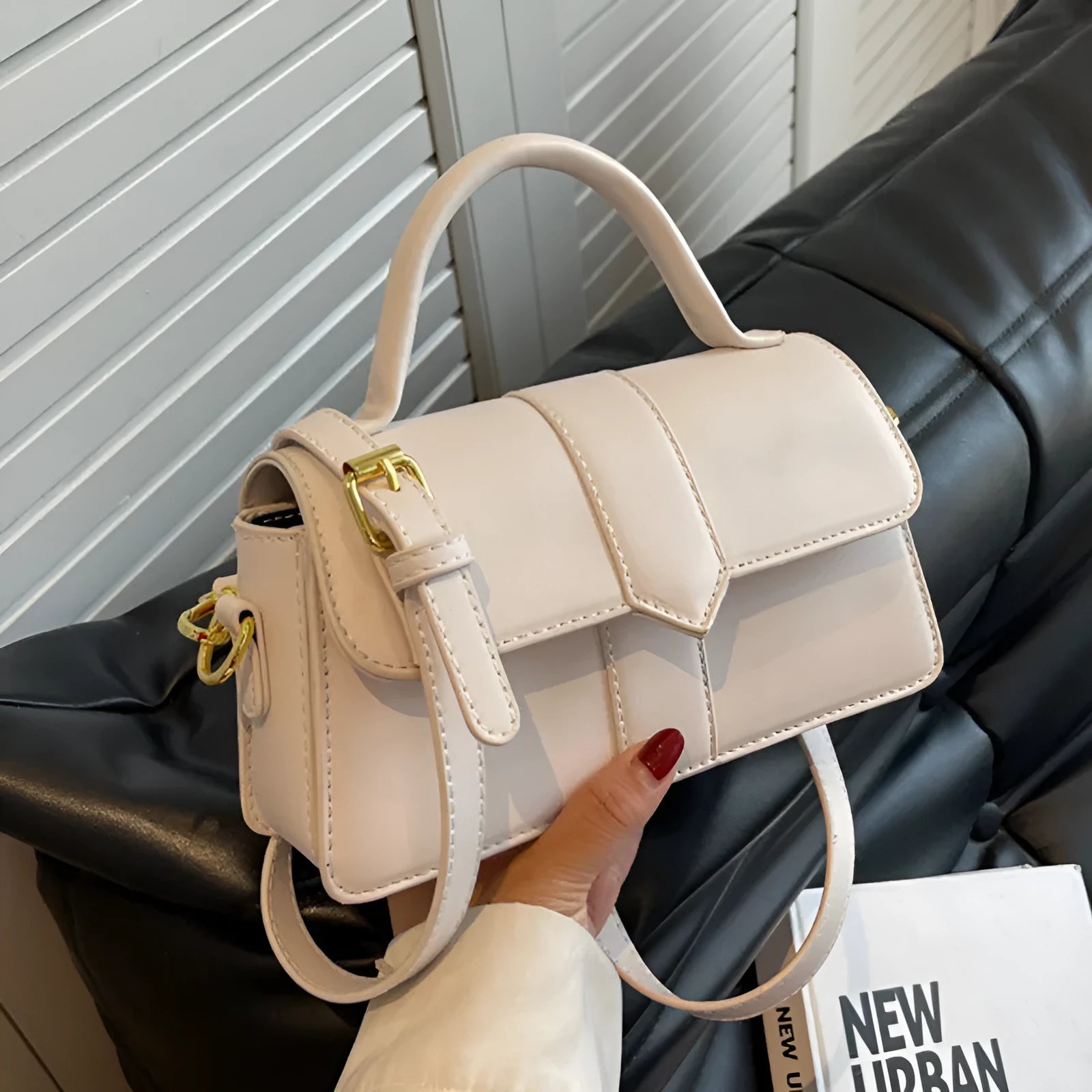 Women's beige messenger bag with horizontal square design showing external pockets and 22cm width