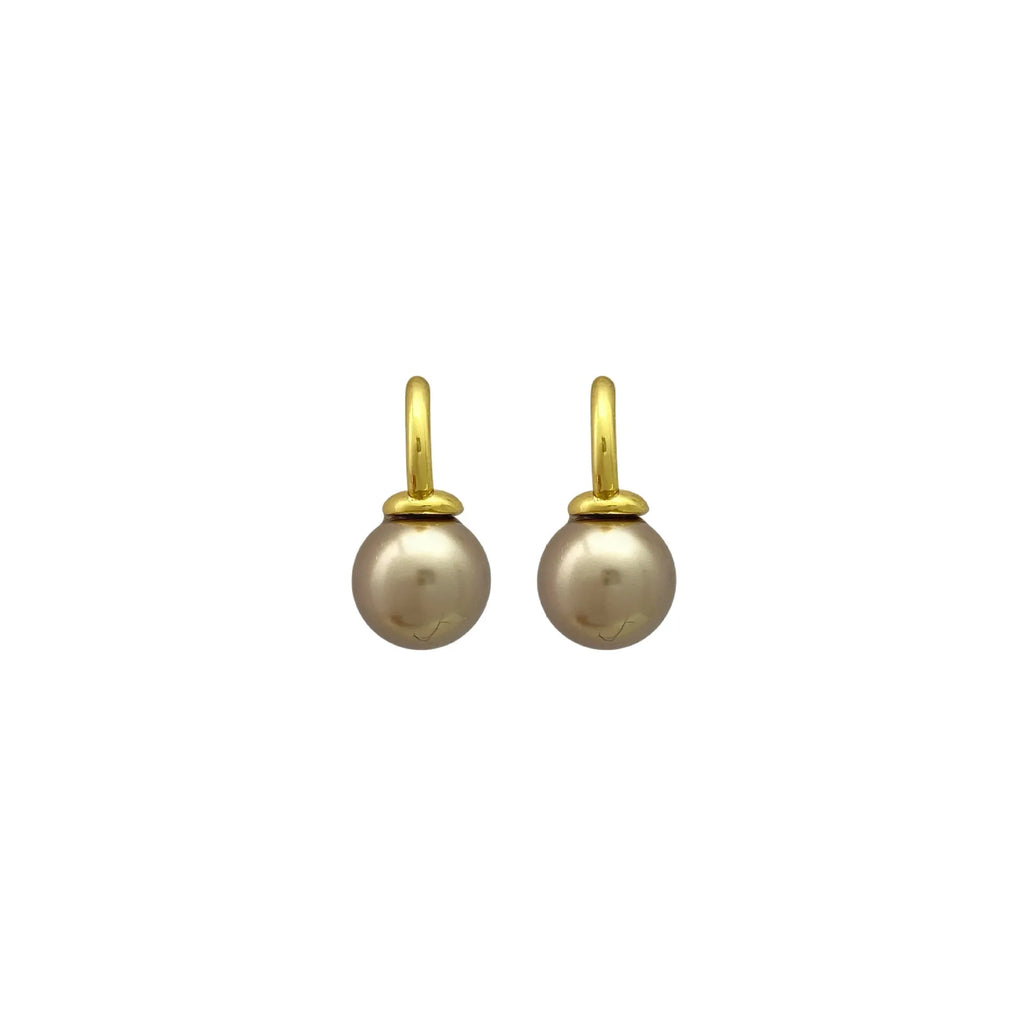 Vintage champagne pearl clip-on earrings with copper electroplated geometric design, on display as a pair