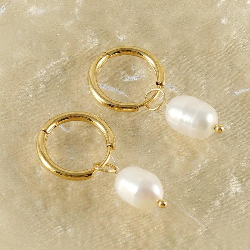 Gold-coloured geometric drop earrings with pearl accents on stainless steel for women