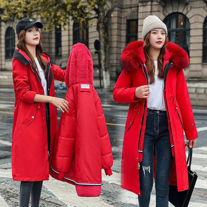 Women's long white padded trench coat with down cotton filler and fleece construction on a hanger.
