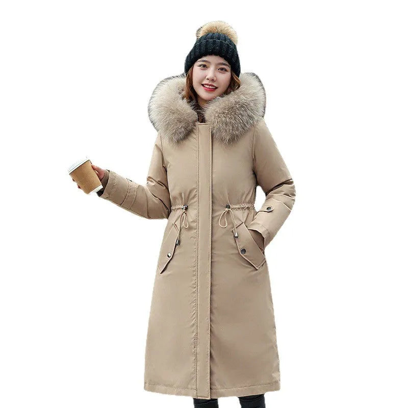 Women's long white padded trench coat with down cotton filler and fleece construction on a hanger.