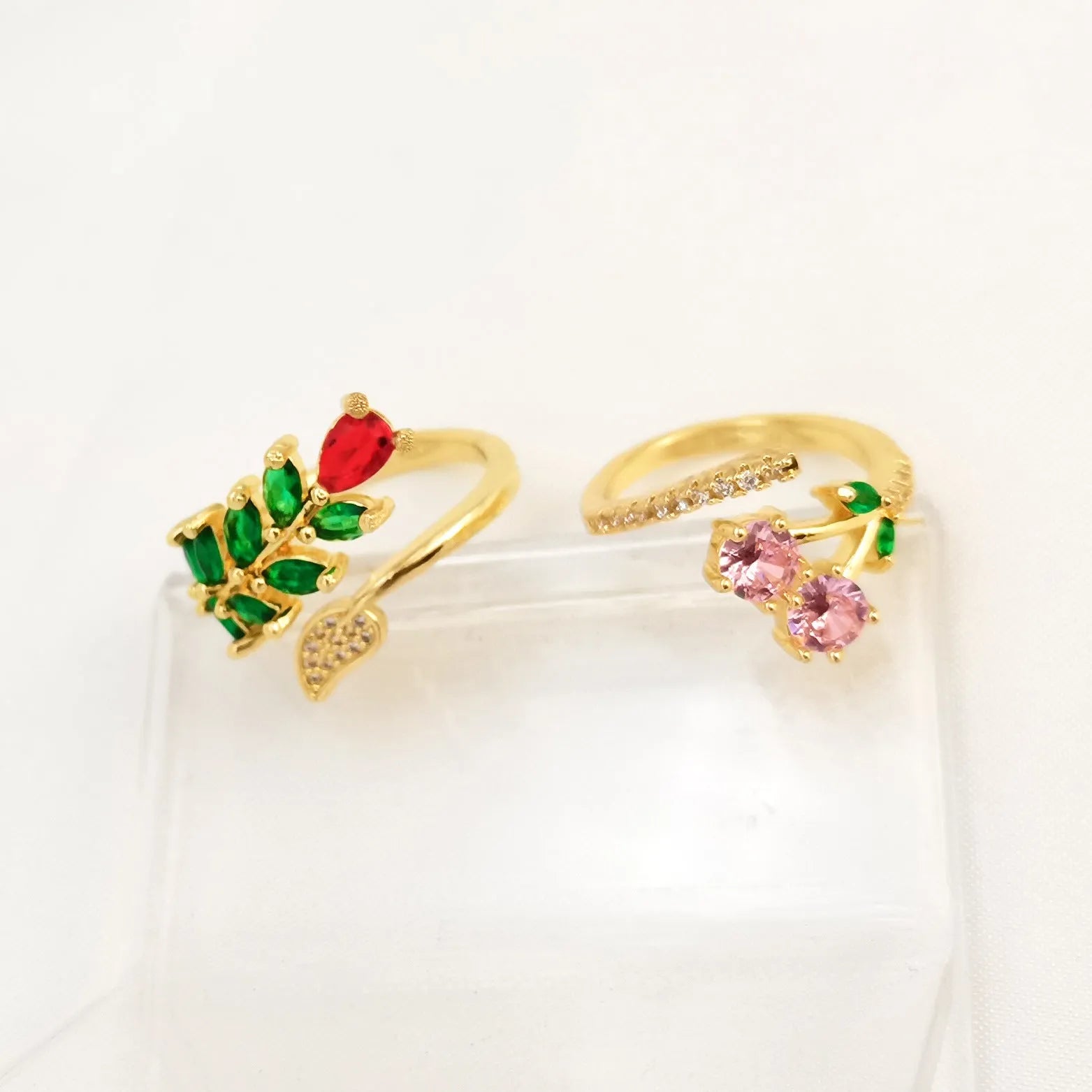 Gold and zircon geometric leaf design on a women's copper open ring.