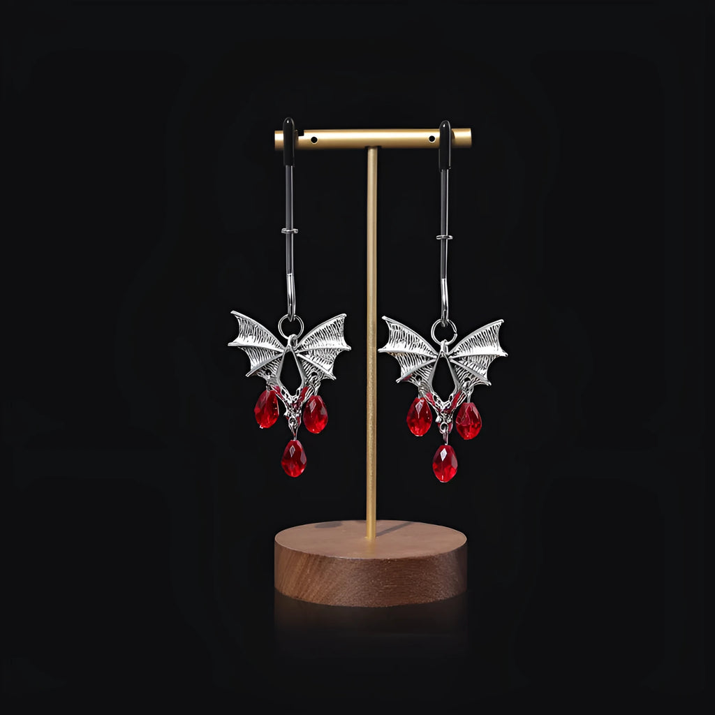 Silver alloy Diamond Bat Nipple Clamp with adjustable screw and ruby bat clip on a white background