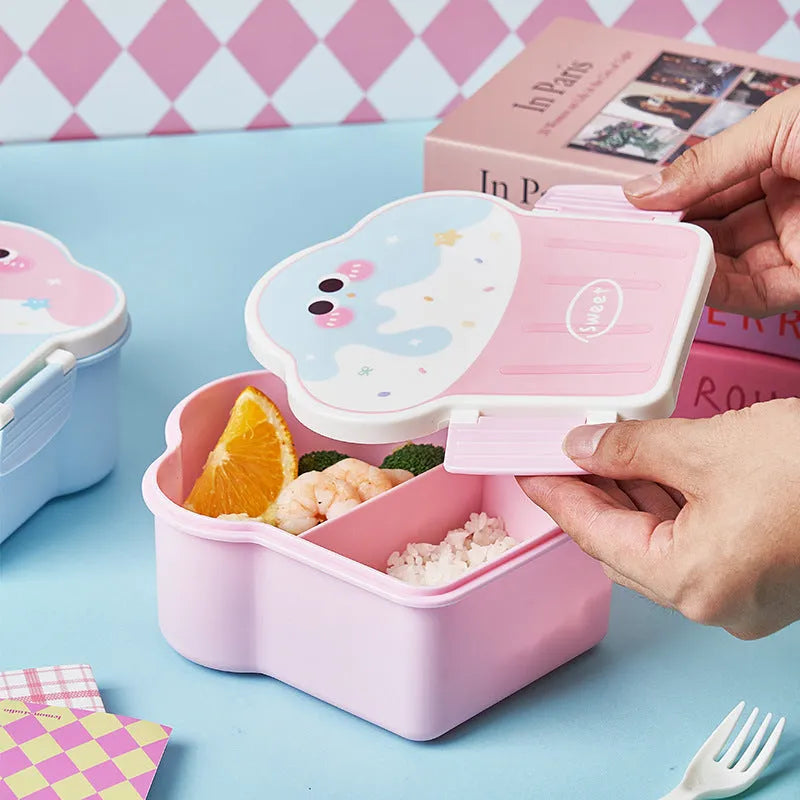 Pink and blue creative ice cream shaped plastic lunch box with spoon and fork set on a table.
