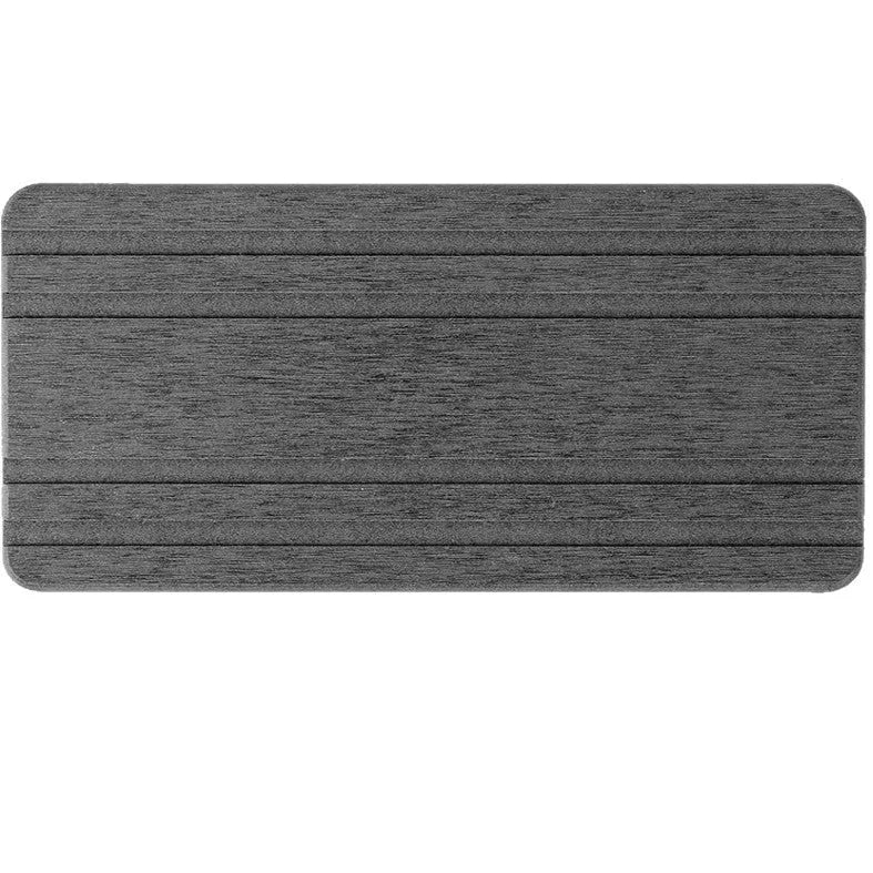 Set of three square diatom oil water draining pads in dark gray, light gray, and white on a bathroom countertop
