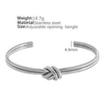 Stainless steel 18K gold plated knotted open double-layer bracelet in gold (SZ46G) on a white background