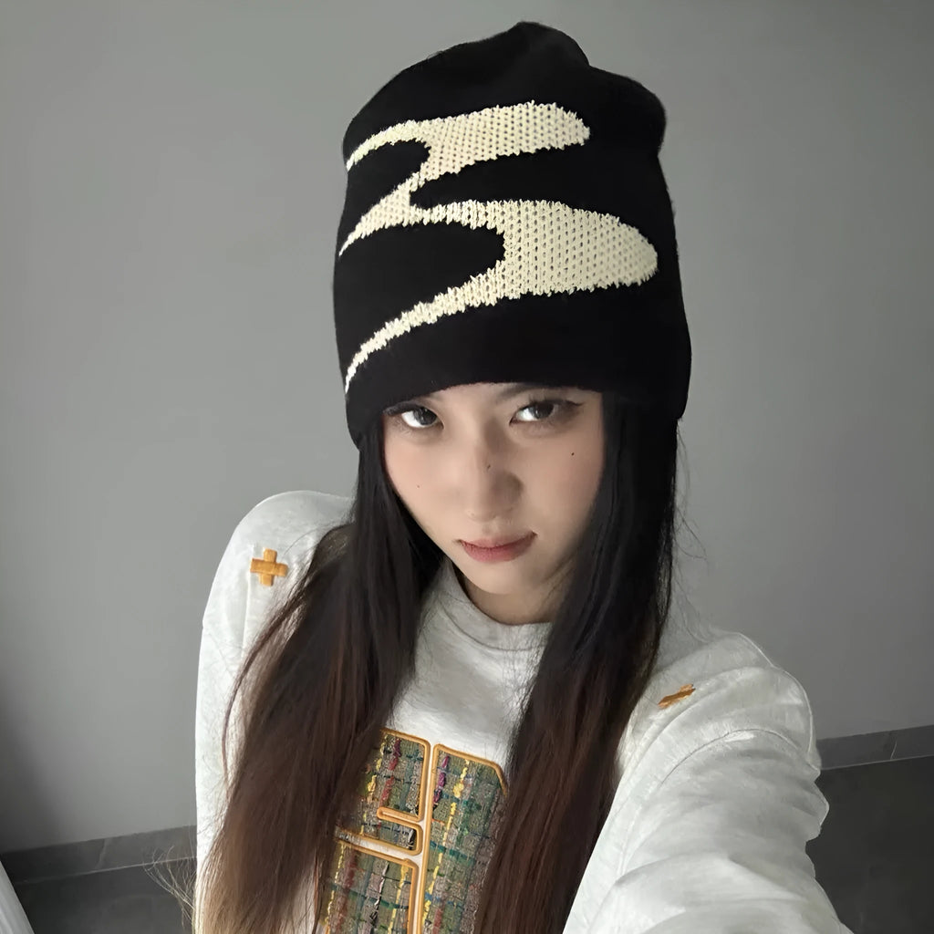 Acrylic knitted beanie hat in black colour showing thermal winter cap design