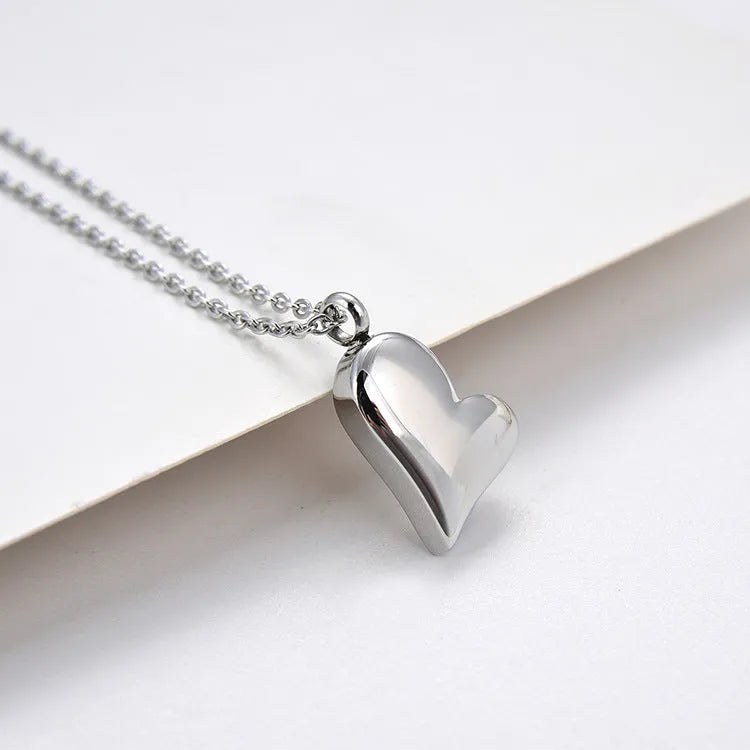 Silver curved heart pendant on adjustable stainless steel necklace chain